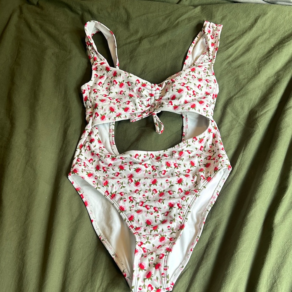 Floral bathing suit with flattering cutouts. From Target, size Medium.